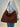 Caralal shoulder bag woven cow COGNAC